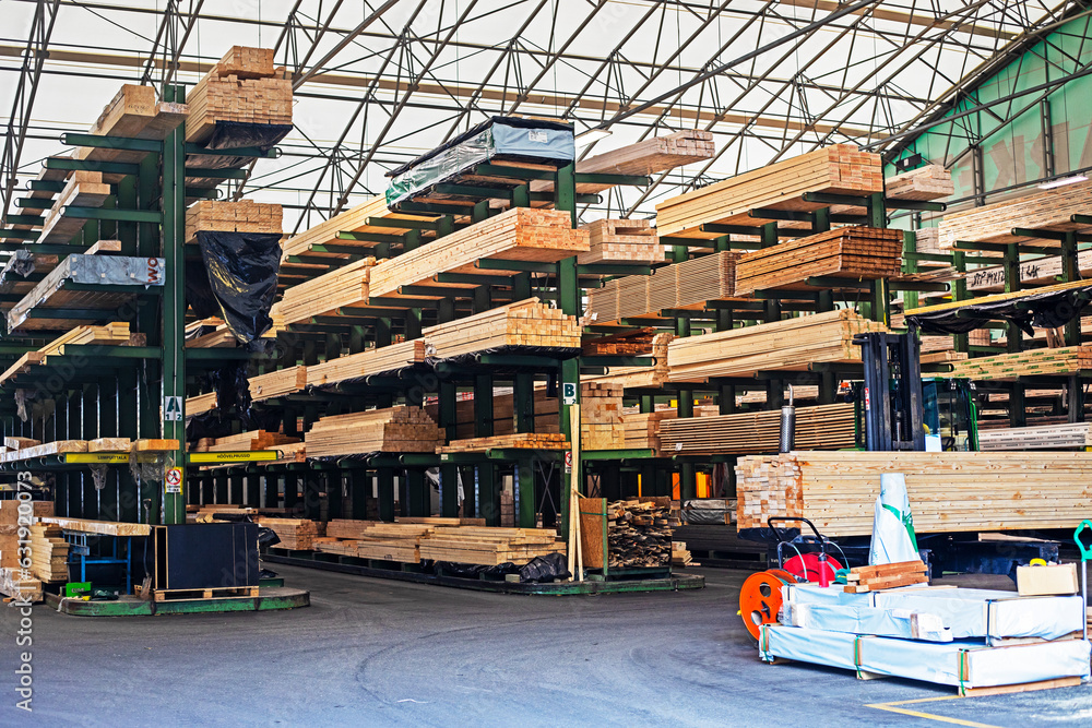 pine and beech boards and various wooden materials for construction and repair on special shelves in a hardware store pine and beech boards and various wooden materials for construction and repair on special shelves in a hardware store