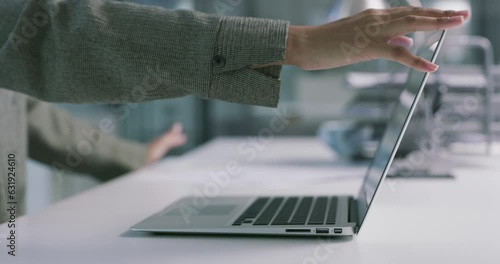Technology and hands of a businesswoman closing a laptop at a desk in office for work. Turn off, offline or finish and complete task and with woman close a computer at modern workplace on table photo