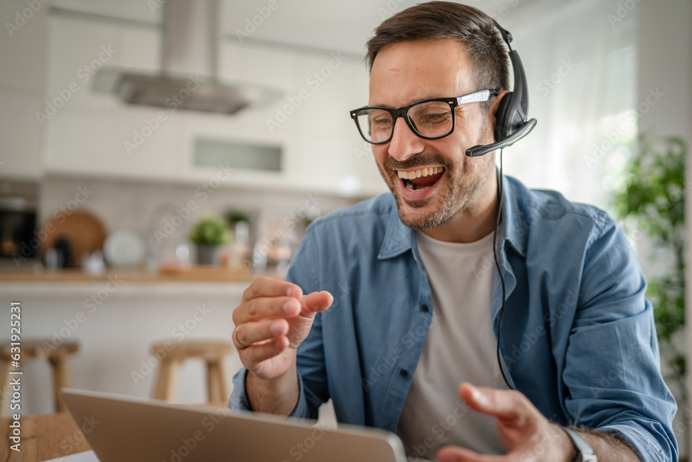 One man caucasian male freelancer work from home on laptop computer