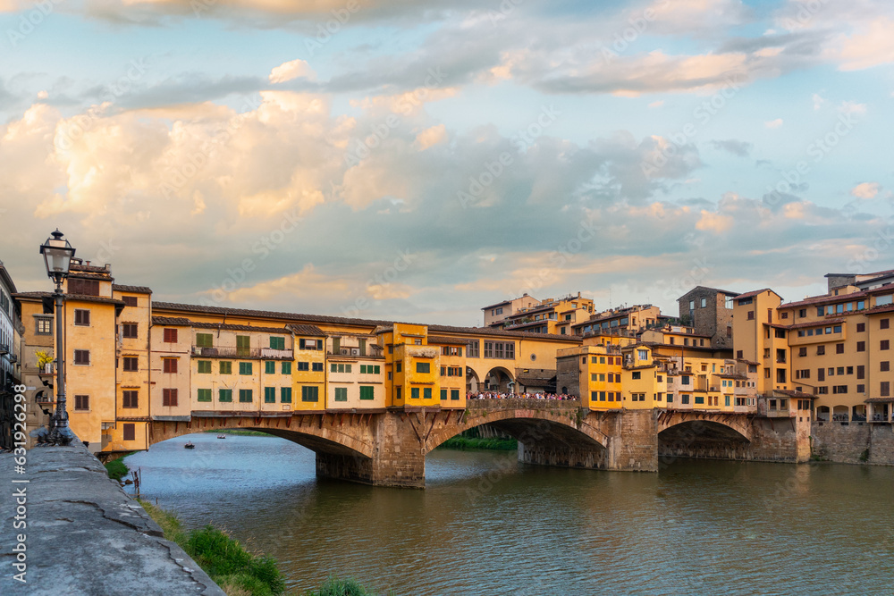 Ponte Vecchio bridge over the Arno river in Florence, Italy. Traditional Italian architecture in the Tuscany.