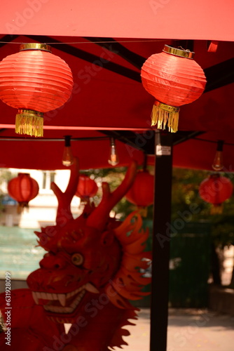 Outdoor summer cafe with Chinese red lanterns and red dragon