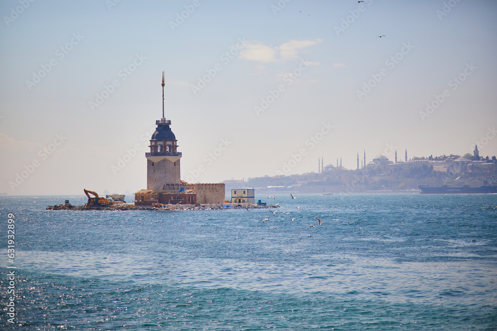 view to Maiden's tower in Uskudar distric on Asian side of the city across the Bosphorus strait in Istanbul, Turkey