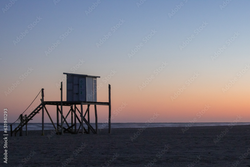 Lifeguard box on a serene sunrise