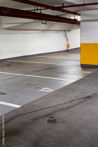 Empty underground parkade with footprint  underground car park with view of parking stalls