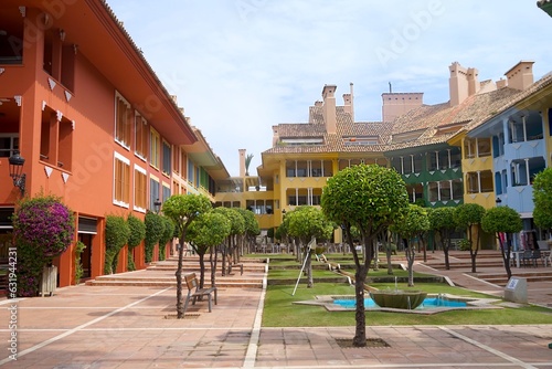 square with colorful houses in Sotogrande at the Mediterranean Sea, Cádiz, Andalusia, Malaga, Spain