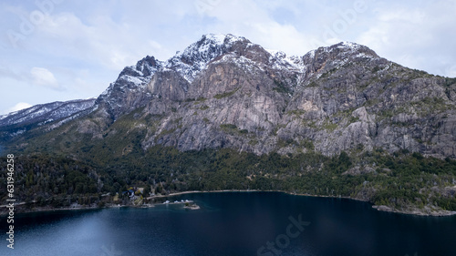 Beautiful chain of snowy mountains and a lake with blue sky above in Bariloche Argentina  amazing panoramic view at Circuito Chico Patagonia