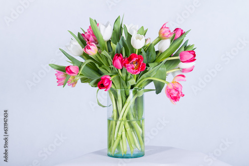 Beautiful bouquet arranged in a vase, on a white background © the_akg