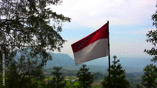 The Indonesian flag fluttering on the hill.