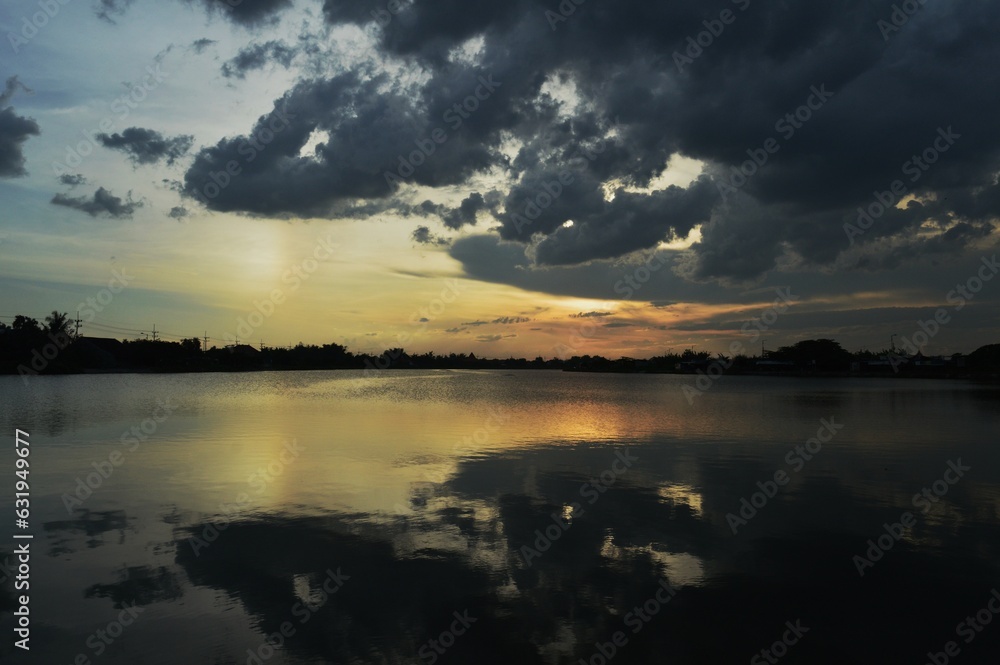 cloudy sky at sunset in the river