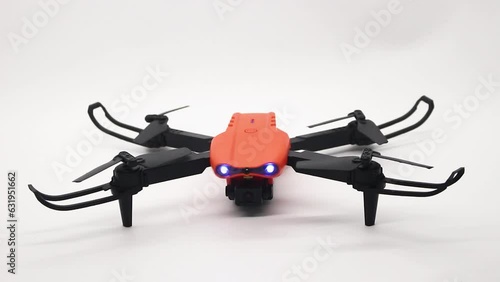 Orange drone with camera and remote control