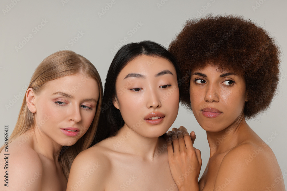 Portrait of beautiful young women on light grey background Portrait of beautiful young women on light grey background