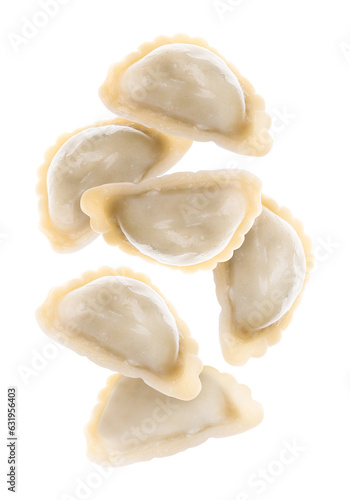 Tasty dumplings (varenyky) falling against white background