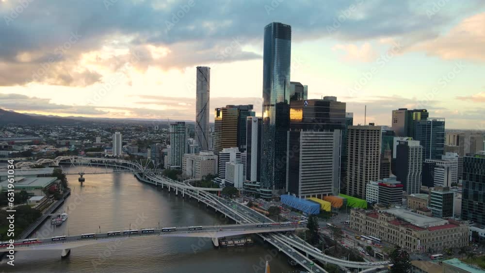 Aerial drone pullback reverses view of Brisbane City, QLD, Australia looking toward the west facing side of the city along Brisbane River and Riverside Expressway during late afternoon in August 2023 Aerial drone pullback reverses view of Brisbane City, QLD, Australia looking toward the west facing side of the city along Brisbane River and Riverside Expressway during late afternoon in August 2023