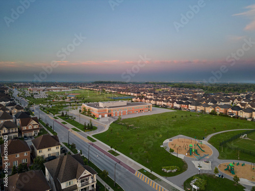 Experience the magic of Vaughan sunrise through mesmerizing drone photos. Witness the enchanting amusement park, thrilling roller coasters, and vibrant Vaughan schools