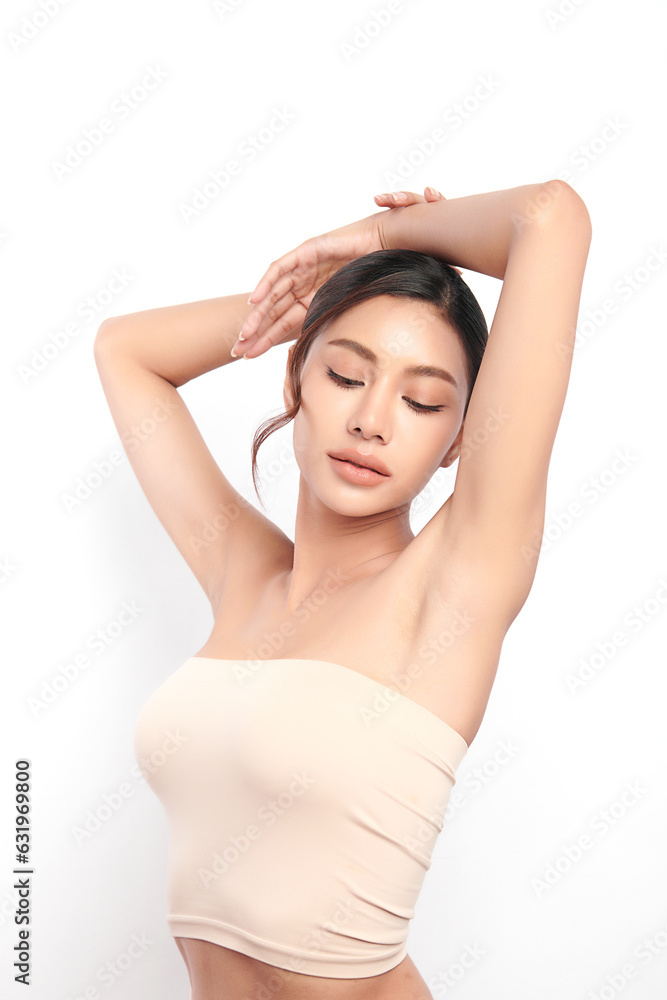 Beautiful Young woman lifting hands up to show off clean and hygienic armpits or underarms on white background, Smooth armpit cleanliness and protection concept Beautiful Young woman lifting hands up to show off clean and hygienic armpits or underarms on white background, Smooth armpit cleanliness and protection concept