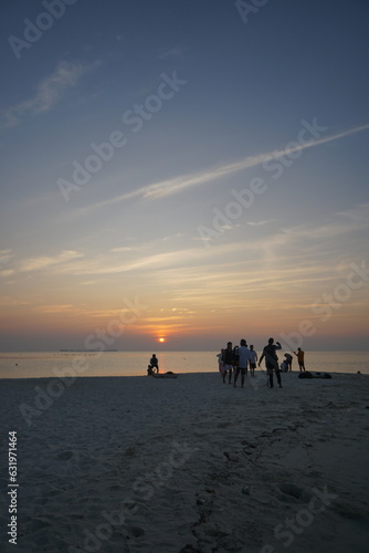 enjoy sunset on the beach © Ardi All