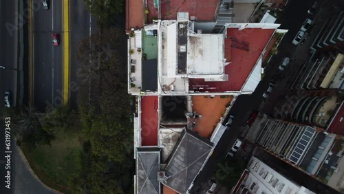 Drone flies over houses and roads, Buenos Aires, diagonal road