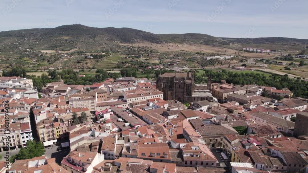 Slow forward aerial over Plasencia city center, vast landscape background, Spain Slow forward aerial over Plasencia city center, vast landscape background, Spain