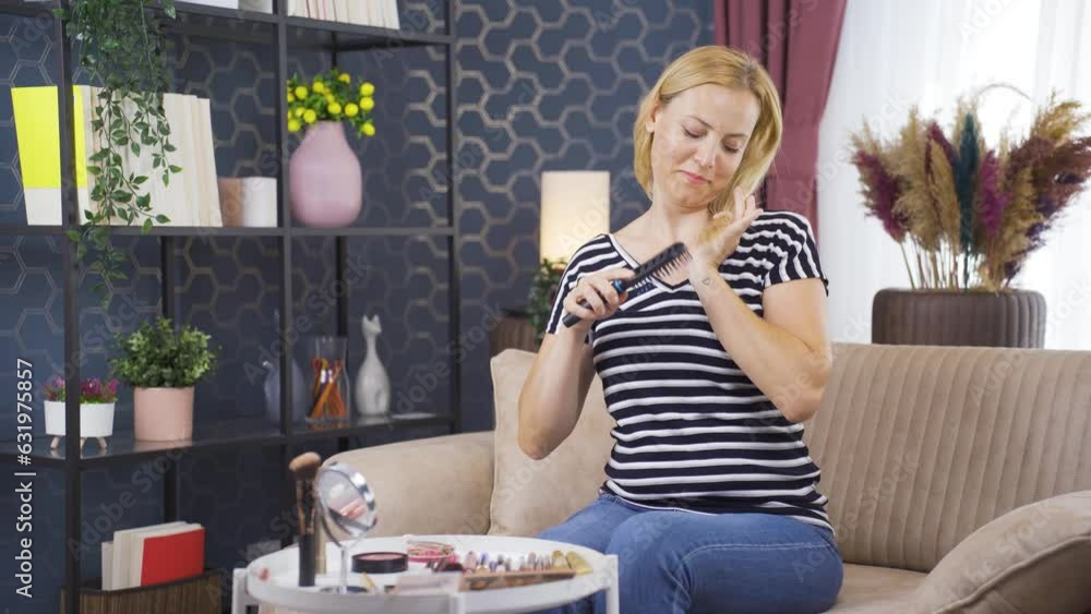 Woman combing her hair. Hair care. Woman combing her hair. Hair care.