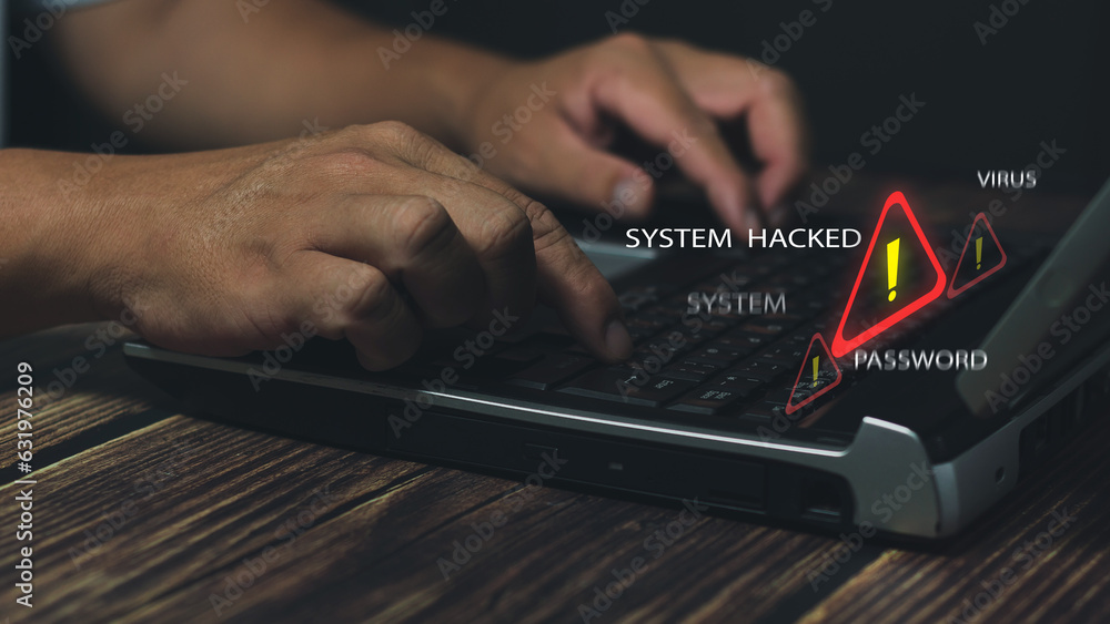Businessman using computer laptop, System warning hacked alertsign for ...