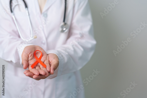 Orange Ribbon for Leukemia, Kidney cancer day, world Multiple Sclerosis, CRPS, Self Injury Awareness month. Healthcare and word cancer day concept