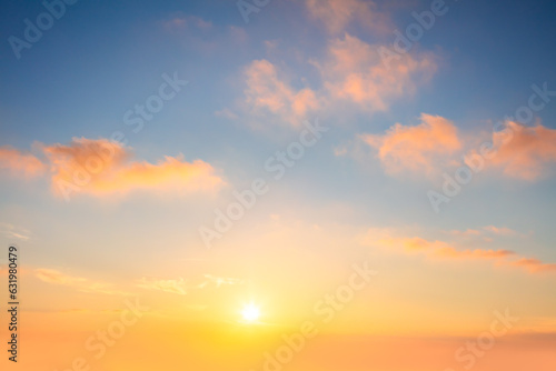 Light Pastel cloudscape. Sunrise sundown sky with gentle colorful clouds without any birds. With sun. © Taiga