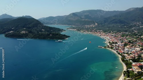 Aerial drone bird's eye view video of iconic port and city of Nidri or Nydri. Harbor for sail boats in Lefkada island, Ionian, Greece	
 photo