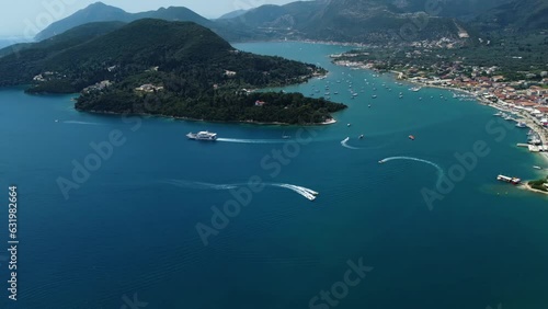 Aerial drone bird's eye view video of iconic port and city of Nidri or Nydri. Harbor for sail boats in Lefkada island, Ionian, Greece
 photo