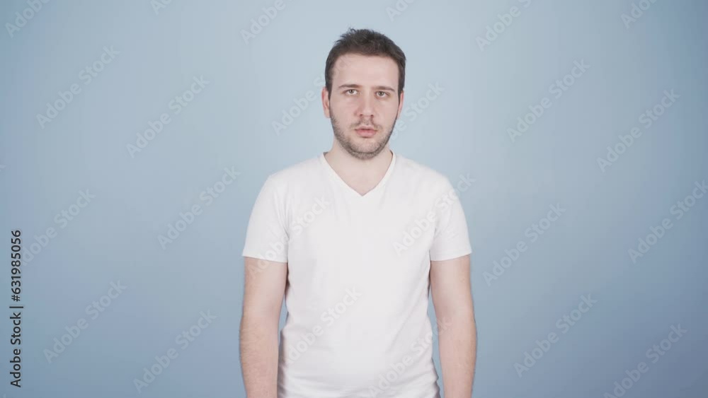 Man looking at camera with dull expression. Man looking at camera with dull expression.