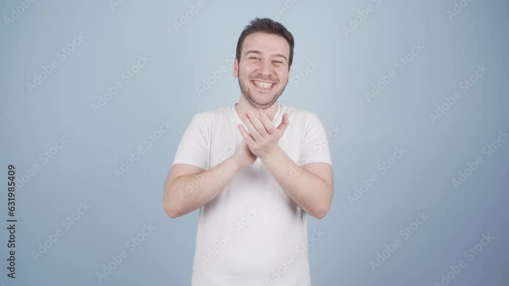 Man clapping excitedly to camera. Man clapping excitedly to camera.