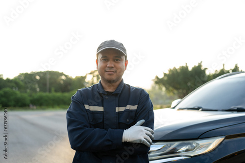 Professional car mechanic maintenance vehicle. The mechanic opens the front of the car. Checking the broken engine. Check the damage as listed. Repair car outside service.