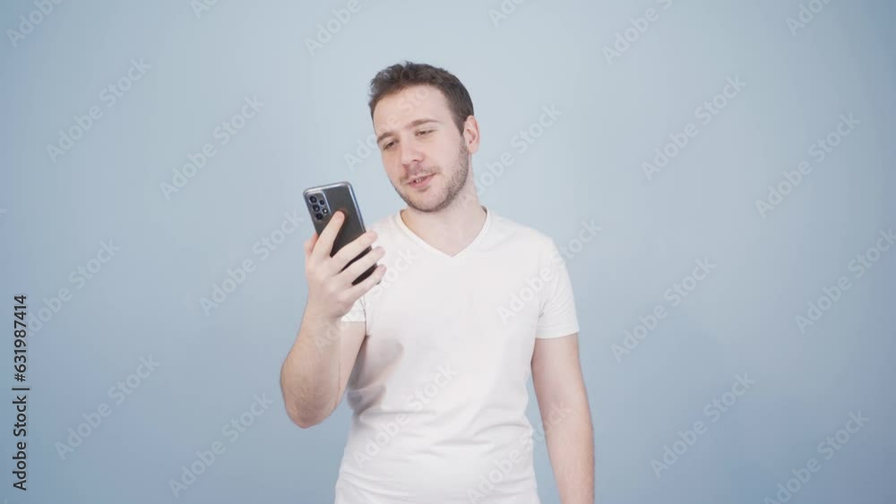 Man making a video call on the phone. Man making a video call on the phone.