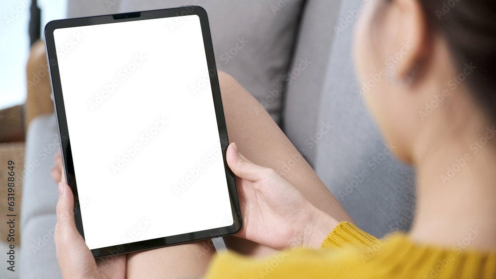 Woman hand using digital tablet with blank screen for mock up, template, people technology and lifestyle Woman hand using digital tablet with blank screen for mock up, template, people technology and lifestyle