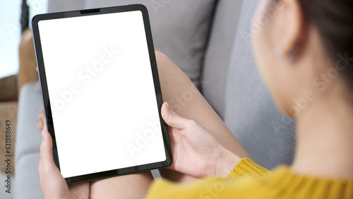 Woman hand using digital tablet with blank screen for mock up, template, people technology and lifestyle