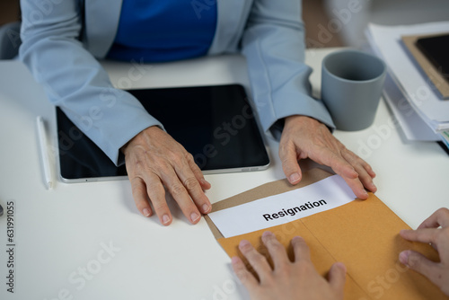 Office worker sends resignation letter to employer Regarding resignation, change of position But the boss did not want to resign, feeling the pressure. concept of resignation, unemployment, change