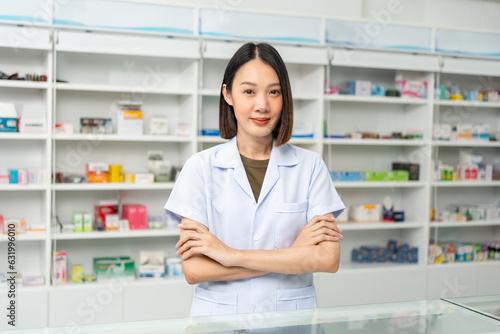 Beautiful asian woman pharmacist checks inventory of medicine in pharmacy drugstore. Professional Female Pharmacist wearing uniform standing near drugs shelves counter Free Download Beautiful asian woman pharmacist checks inventory of medicine in pharmacy drugstore. Professional Female Pharmacist wearing uniform standing near drugs shelves counter - GFXLoad