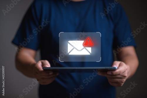 Spam email and virus  concept, man using tablet with spam email icon,  scammer,  malware, virus.