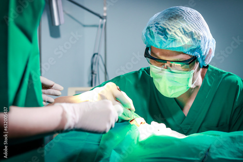 surgical team Performing facial surgery on a patient lying on the bed in the operating room. Emergency surgery. medical services in hospitals