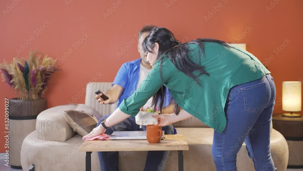 Woman disturbing her husband at home. Woman disturbing her husband at home.