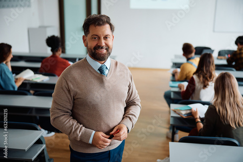 Portrait of happy university teacher during class looking at camera.