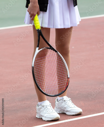 Girl with a racket on the tennis court © schankz