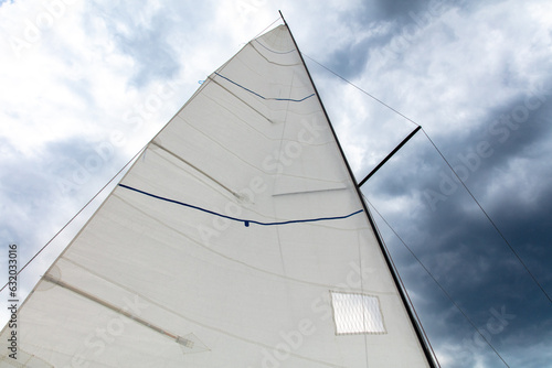 Yacht sail on the background of thunderclouds
