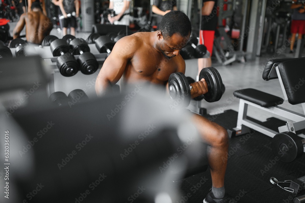 African American young man doing workout at the gym African American young man doing workout at the gym