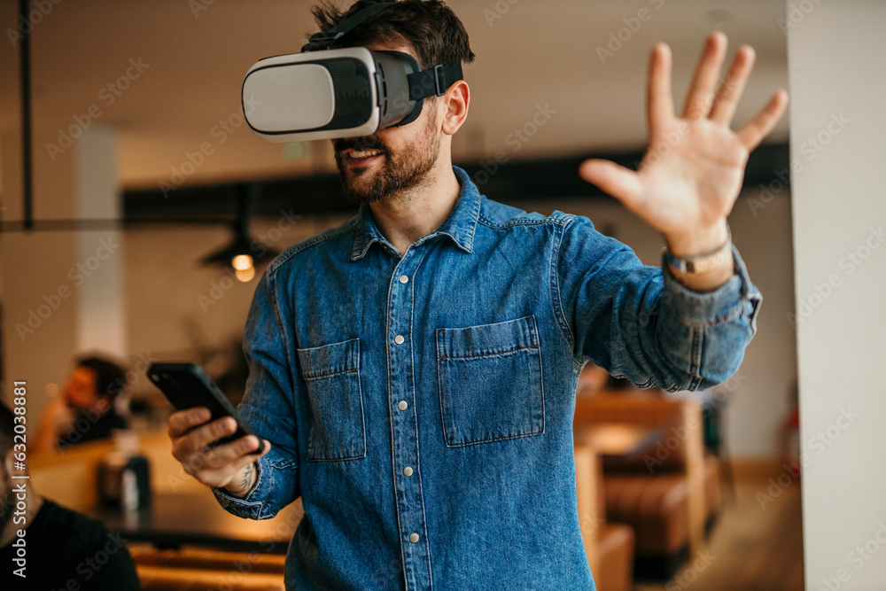 Man using the phone and virtual reality. Education and fun Man using the phone and virtual reality. Education and fun