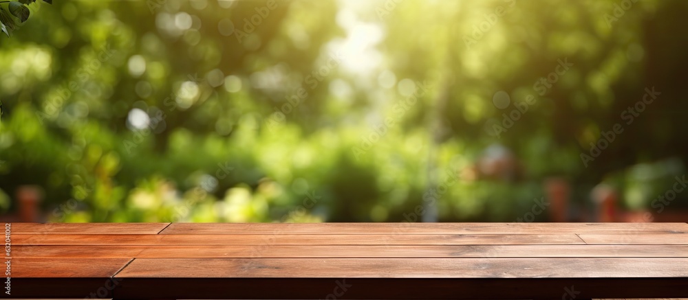An empty wooden table is placed outdoors in a garden, with a blurred background. The table is clean and offers ample space for text, making it suitable for marketing and promotional purposes. It An empty wooden table is placed outdoors in a garden, with a blurred background. The table is clean and offers ample space for text, making it suitable for marketing and promotional purposes. It