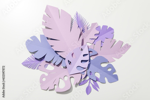 Paper purple tropical leaves on a light background