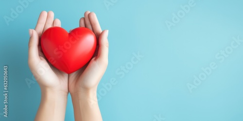 Young women hands holding red heart on blue background, health care, donate and family insurance concept, world heart day, world health day, CSR responsibility, adoption foster family, generative ai photo