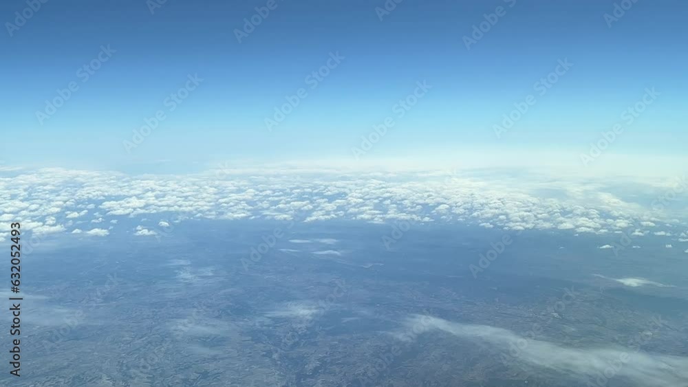 Aerial view of the crossing of two jets flying opposite direction shot from a jet cabin. A pilot’s point of view with the minimun vertical safe separation.