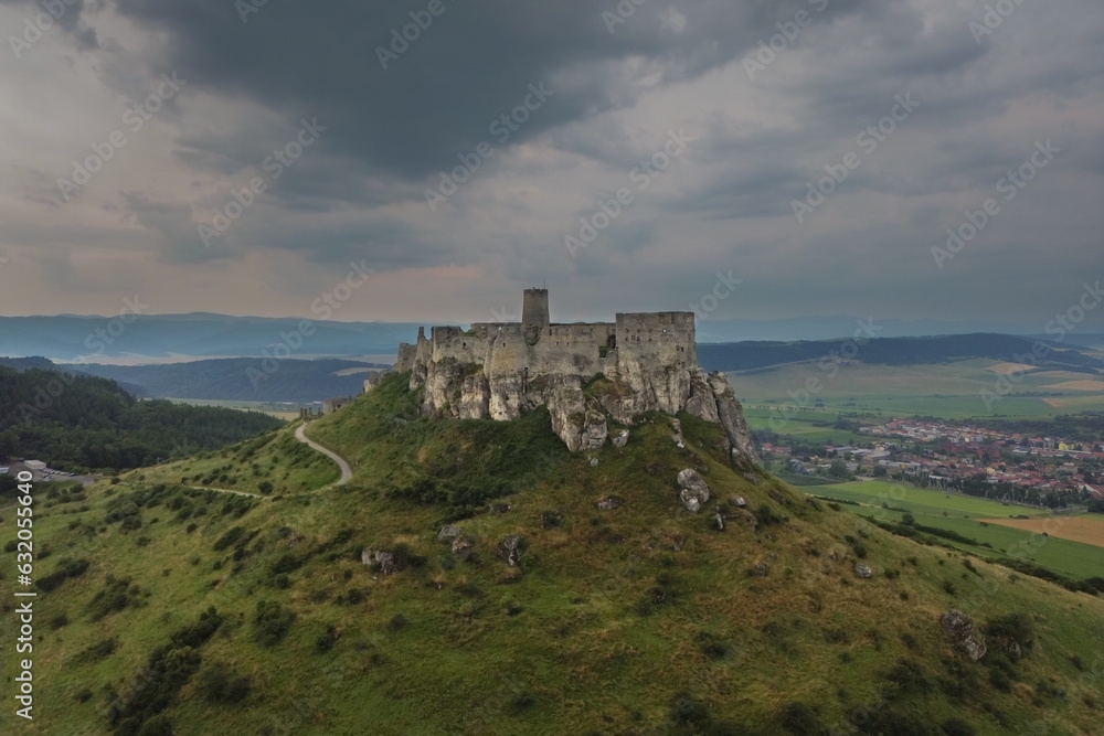 Aerial view of Spis castle with stormy clouds in the background Aerial view of Spis castle with stormy clouds in the background