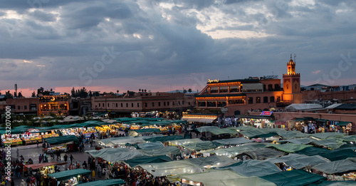 Jamaa el Fna square in Marrakesh at sunset photo